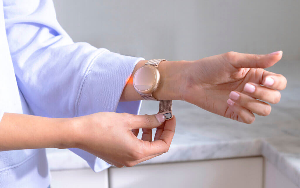 embr wave wrist on a woman in the kitchen